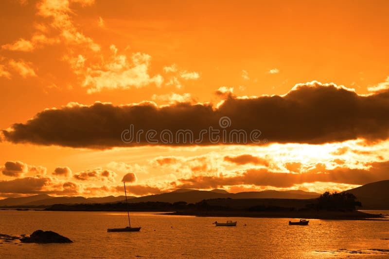 Boats in a quiet bay with island close to kenmare