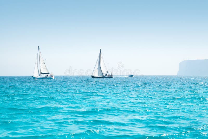 Boats sail regatta with sailboats in mediterranean