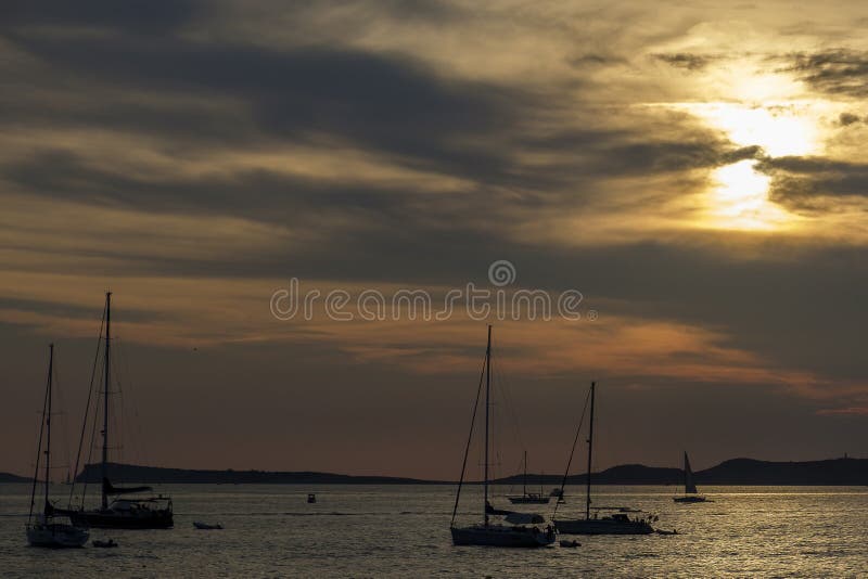 Boats in the sea in front of CafÃ© del Mar at the Spanish Island Ibiza in the mediterranean sea in Europe. CafÃ© del Mar is a famous spot on the island and the best place for sunset. Boats in the sea in front of CafÃ© del Mar at the Spanish Island Ibiza in the mediterranean sea in Europe. CafÃ© del Mar is a famous spot on the island and the best place for sunset.