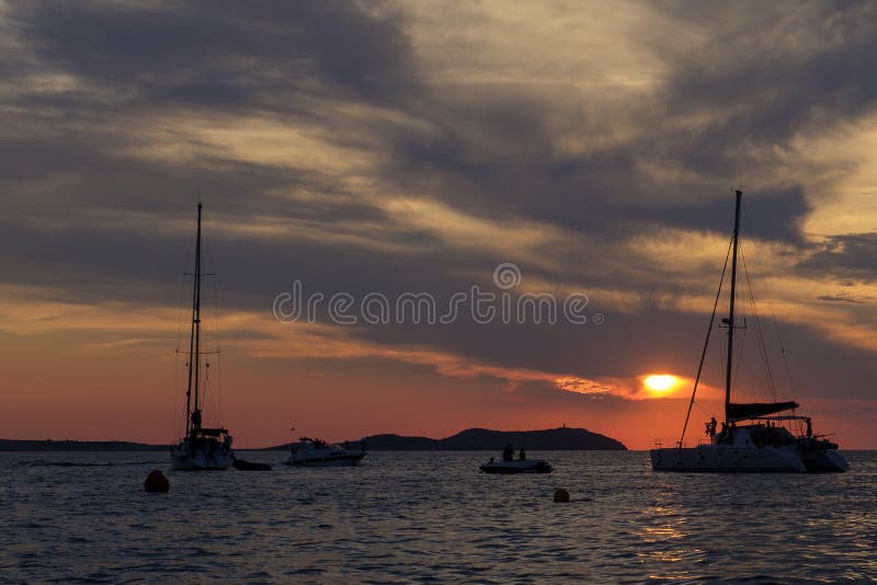 Boats in the sea in front of CafÃ© del Mar at the Spanish Island Ibiza in the mediterranean sea in Europe. CafÃ© del Mar is a famous spot on the island and the best place for sunset. Boats in the sea in front of CafÃ© del Mar at the Spanish Island Ibiza in the mediterranean sea in Europe. CafÃ© del Mar is a famous spot on the island and the best place for sunset.