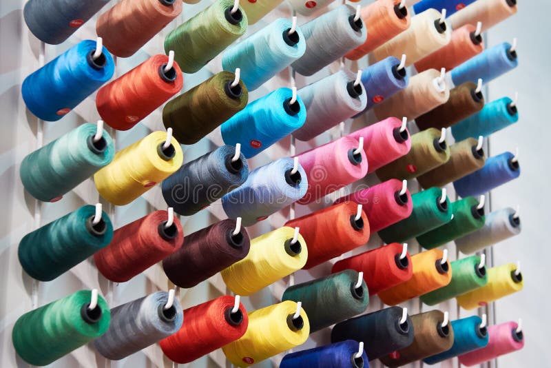 Bobbins with colored thread for industrial textile