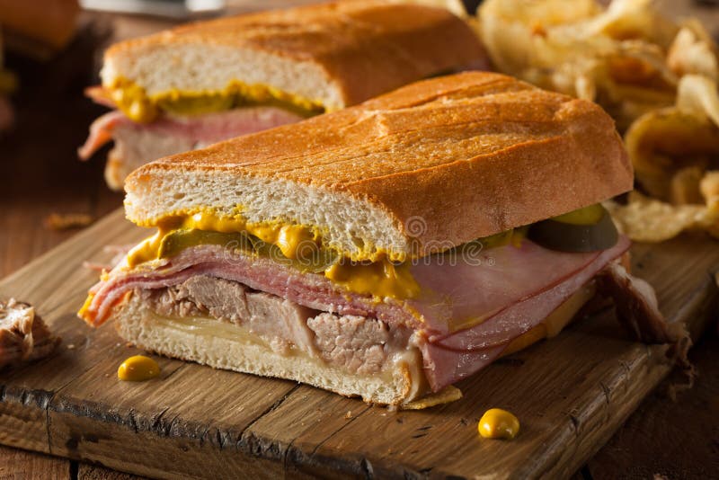 Homemade Traditional Cuban Sandwiches with Ham Pork and Cheese. Homemade Traditional Cuban Sandwiches with Ham Pork and Cheese