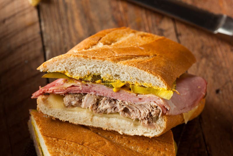 Homemade Traditional Cuban Sandwiches with Ham Pork and Cheese. Homemade Traditional Cuban Sandwiches with Ham Pork and Cheese