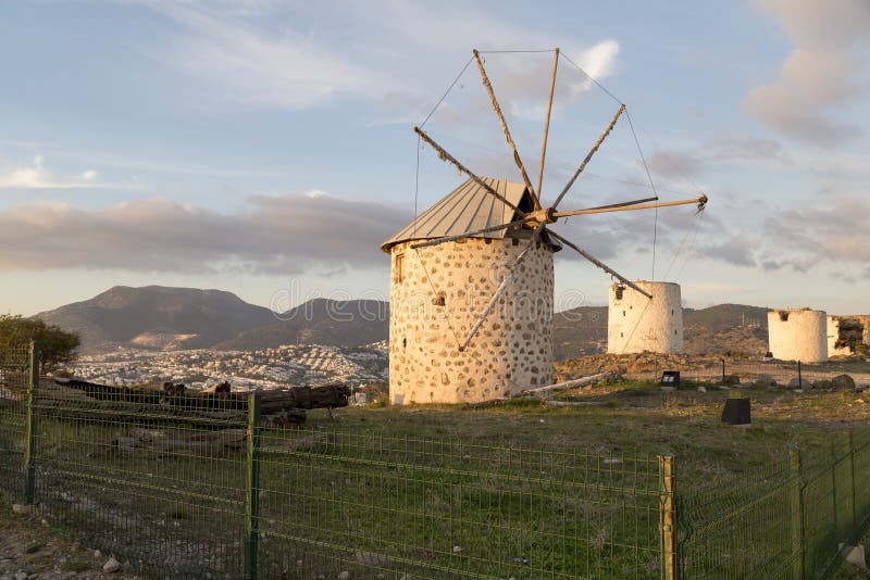 Sunset view of Bodrum town located on the Aegean coatline of Turkey, famous for summer attractions, windmills and nightlife. Turkish Riviera. Sunset view of Bodrum town located on the Aegean coatline of Turkey, famous for summer attractions, windmills and nightlife. Turkish Riviera