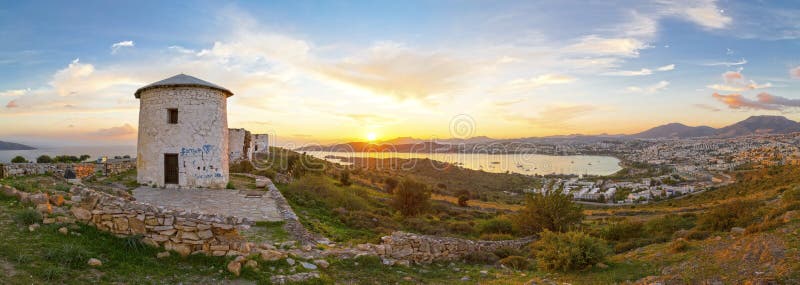 Sunset view of Bodrum town located on the Aegean coatline of Turkey, famous for summer attractions, windmills and nightlife. Turkish Riviera. Sunset view of Bodrum town located on the Aegean coatline of Turkey, famous for summer attractions, windmills and nightlife. Turkish Riviera