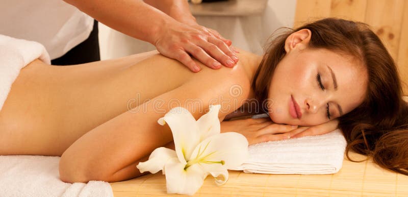 Body care. Spa body massage treatment. Woman having massage in t