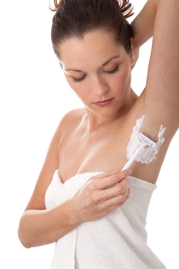 Body care - Young woman shave her armpit
