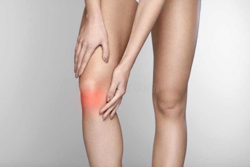 Body Pain. Close-up Of Beautiful Female Body With Pain In Knees