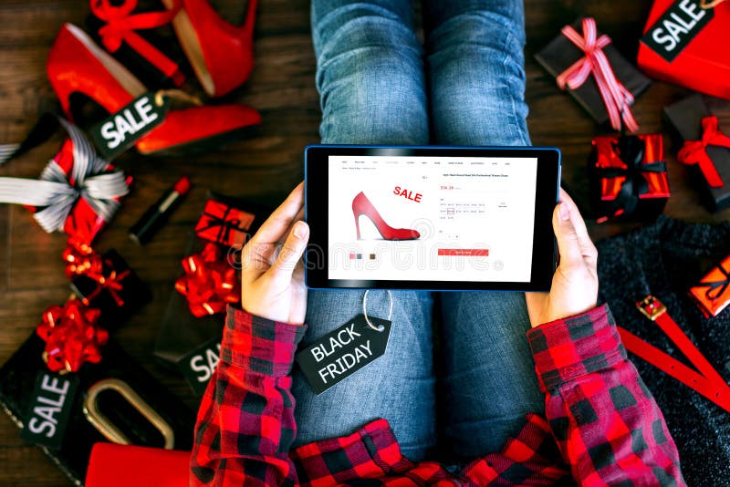 Body part of woman female adult buying new red high heels on internet online store shop with tablet during black friday holiday royalty free stock images Body part of woman female adult buying new red high heels on internet online store shop with tablet during black friday holiday royalty free stock images