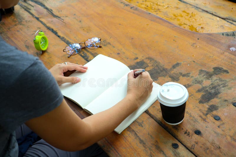 Body part. Woman writing on note book . stock images Body part. Woman writing on note book . stock images