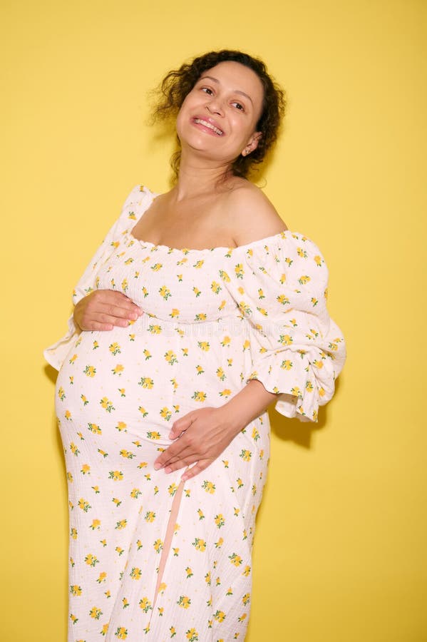 Delightful Pregnant Woman with Big Belly Holds an Ironed Bodysuit for Her  Future Newborn Baby. Stock Photo - Image of abdomen, cleanliness: 276705074