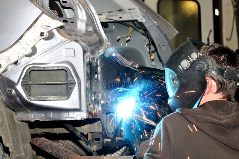 Body Worker Welding Panels. Stock Image Image of industrial, body