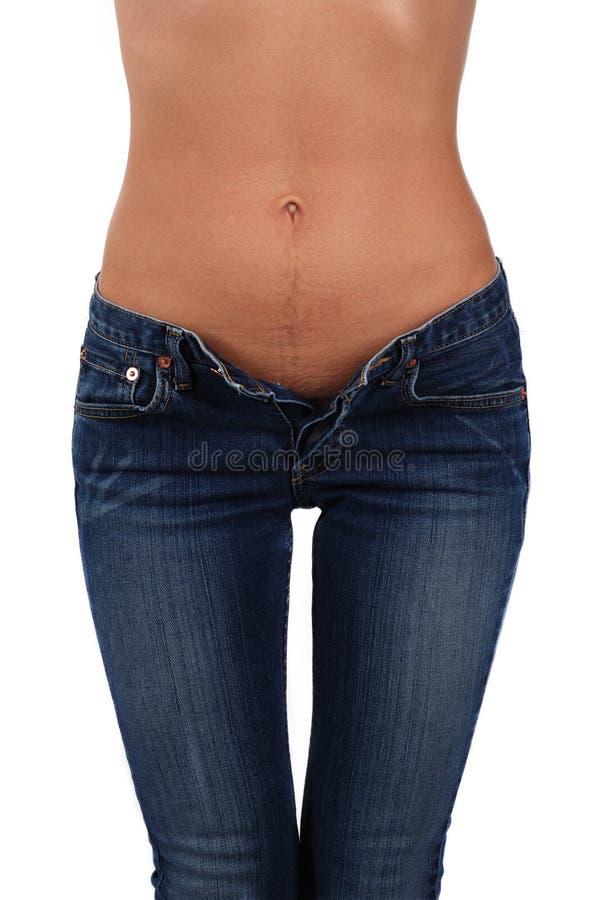 Body of a young woman in jeans