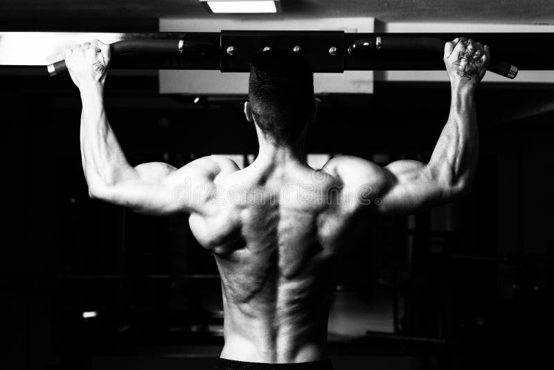 Male Athlete Doing Pull Ups Stock Image Image of muscular