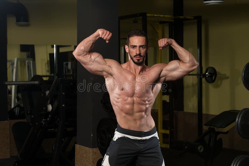 Bodybuilder Performing Rear Double Biceps Pose Stock Image Image Of