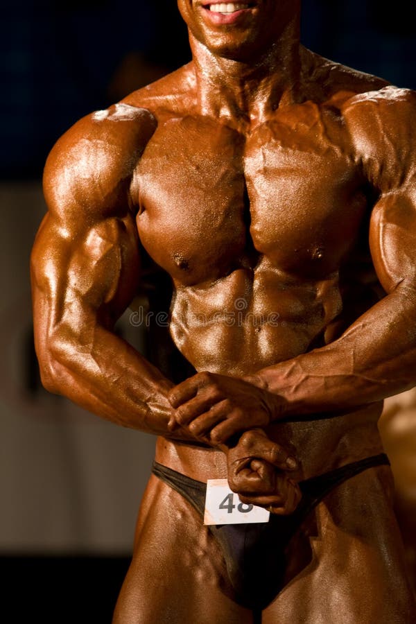 Bodybuilder posing in a competition