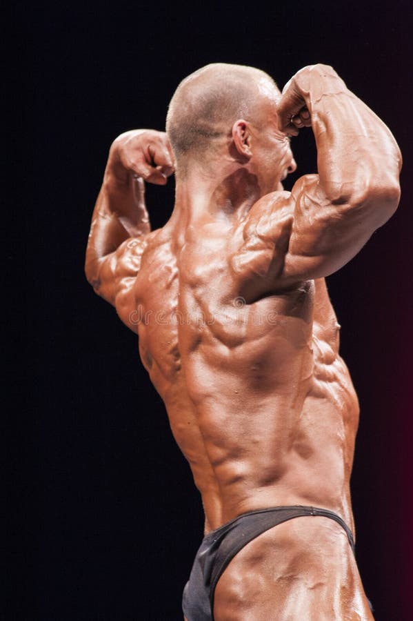 Bodybuilder Shows His Front Lats Spread Pose on Stage Editorial Stock Image  - Image of champion, hamstring: 63384449