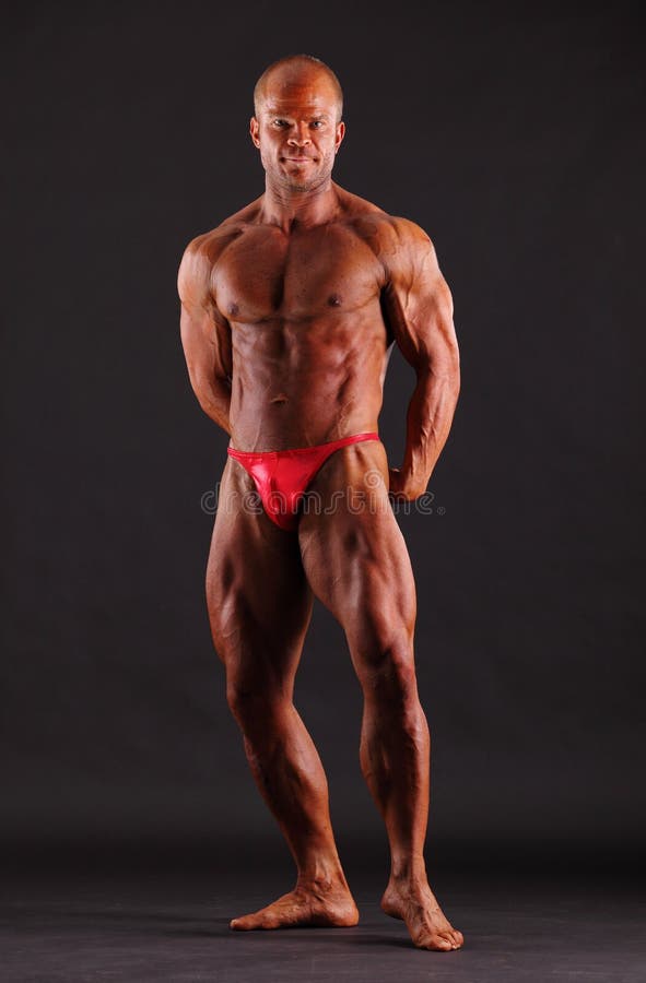 Bodybuilder standing stock images
