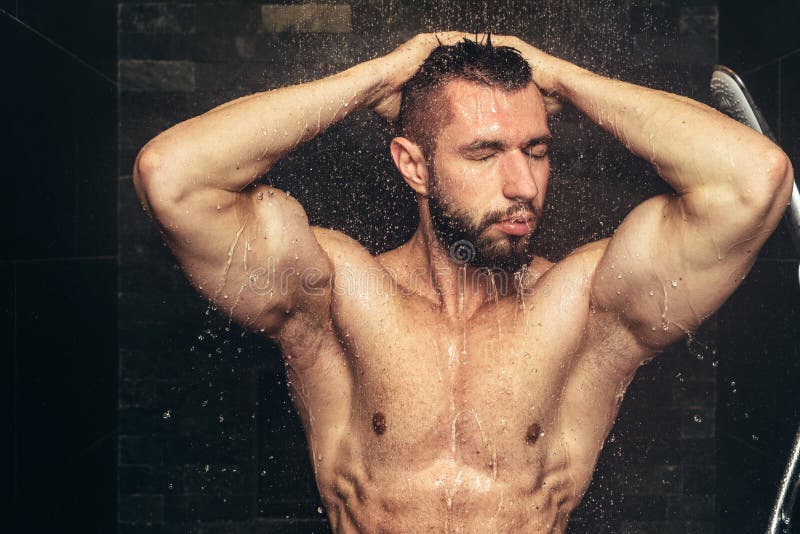 Bodybuilder Taking Shower After Training Handsome Man In Shower With Water Drops And Splashes