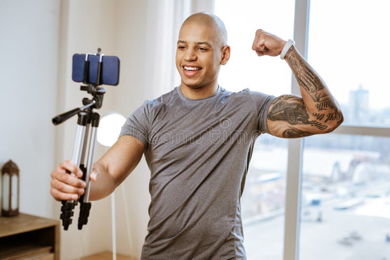Bodybuilder with Tattoo on Hand Wearing White Smart Watch Stock Photo -  Image of coaching, lifestyle: 145274512