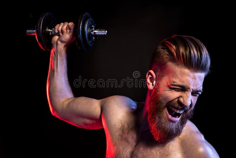 Bodybuilder Training with Dumbbell Isolated on Black with Dramatic