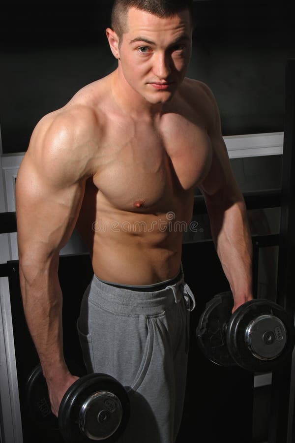 Bodybuilder training hard stock photo. Image of workout 38125054
