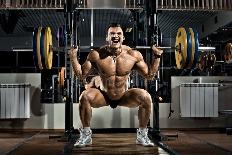 Very brawny guy bodybuilder , execute exercise squatting with weight, in gym
