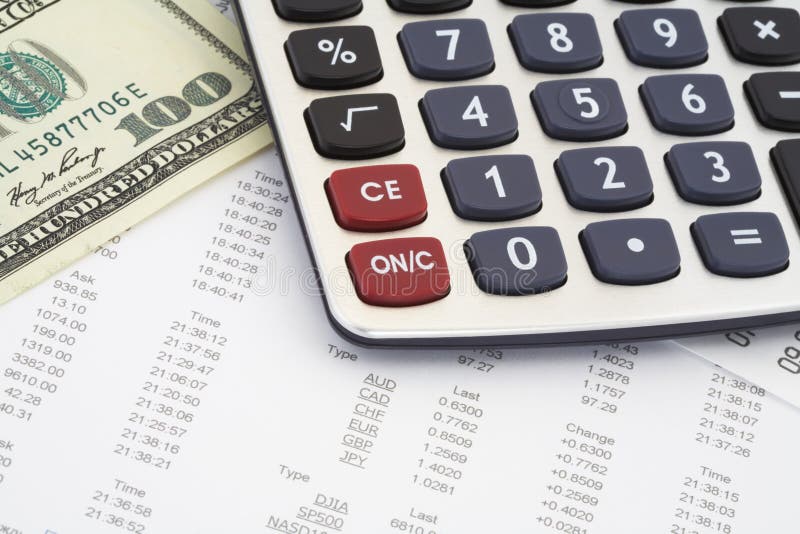 Calculator, dollar on the background of the financial statements. Calculator, dollar on the background of the financial statements