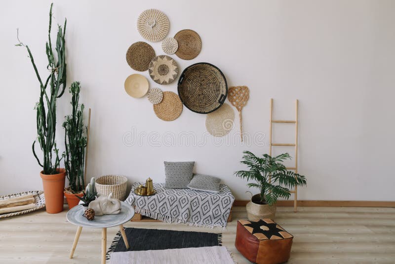 Boho Style, Minimal Home Interior Design. Decorative Straw Plates on the Wall. Exotic Interior