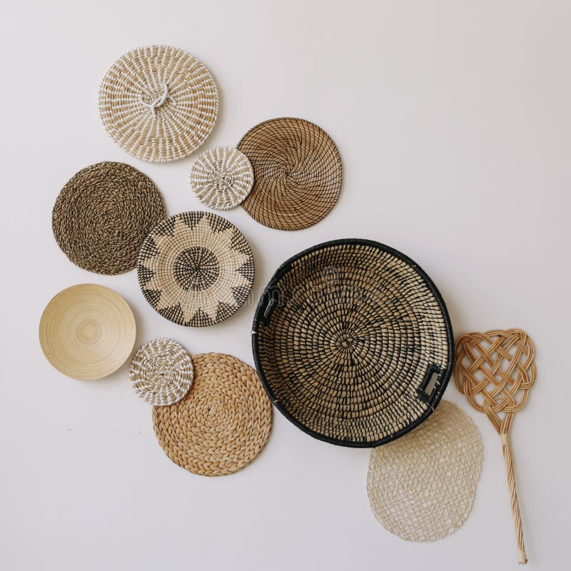 Boho style, minimal home interior design. Decorative straw plates on the wall. Exotic interior. stock photography