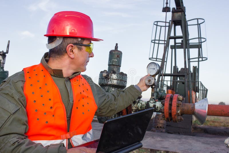 Oil Industry Pump jack with one oil worker. Oil Industry Pump jack with one oil worker.