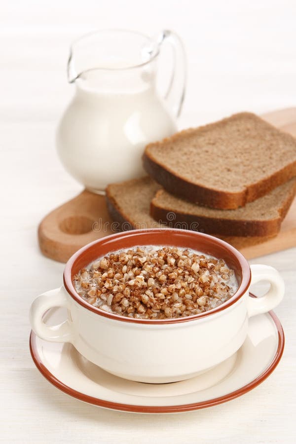 Boiled buckwheat with milk stock image. Image of plate 15335151