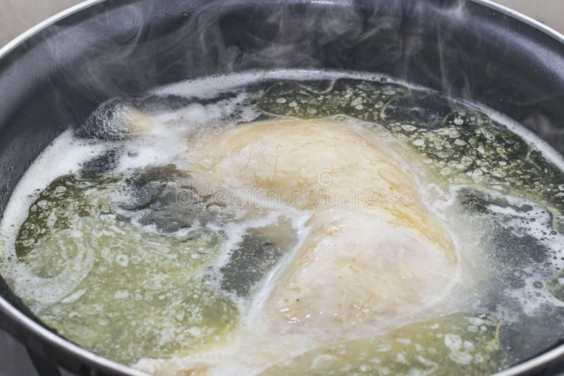 Boiled Chicken in a Pot Broth Close-up with Blurred Background and