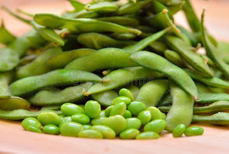 Boiled Green soybeans on wooden background stock photo Boiled Green soybeans on wooden background stock photo