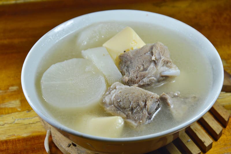 Boiled Radish with Pork Rib and Egg Tofu Soup on Bowl Stock Photo