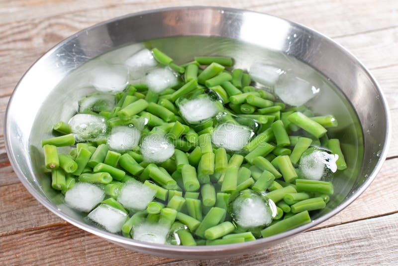 Boiled Vegetables, Green Beans in Ice Water after Blanching on a Table ...