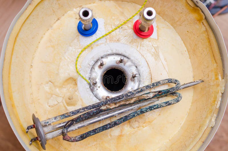 Boiler Repair, Replacement of Broken Water Heating Element Stock Image