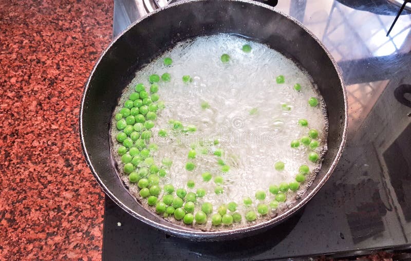 Boiling green peas stock photo. Image of healthy, delicious - 175805142