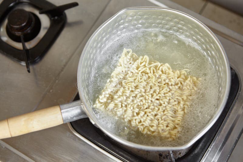 Boiling the instant noodle stock photo. Image of boiled 50404588