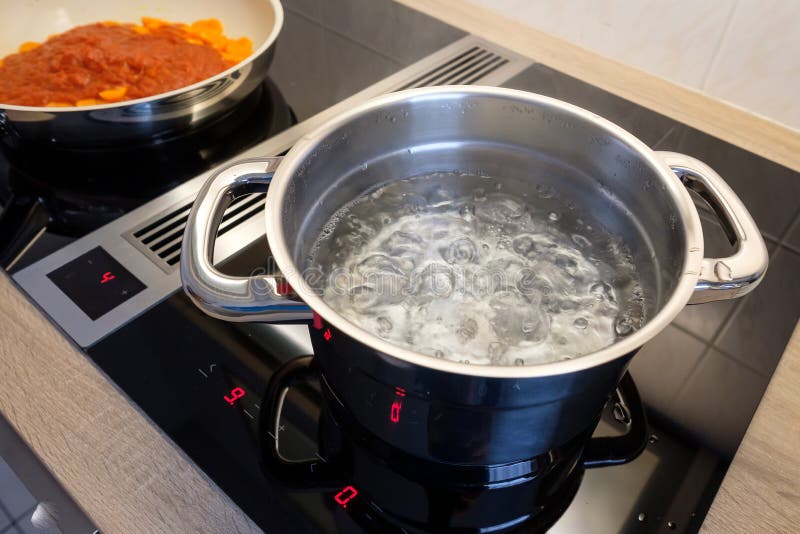 Metal Cooking Pot Standing On Kitchen Stove With Flame. Stock Photo,  Picture and Royalty Free Image. Image 90698051.