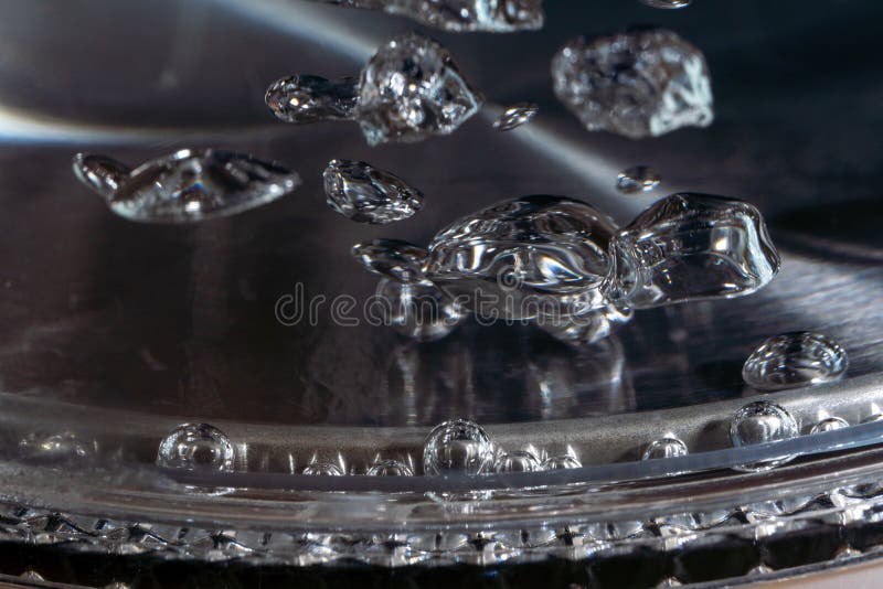 Boiling Water in a Teapot, Water Bubbles in Macro Stock Photo Image