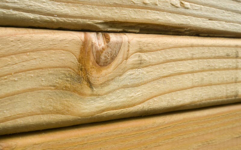 A tight shot of lumber loaded onto a train for transport. A tight shot of lumber loaded onto a train for transport