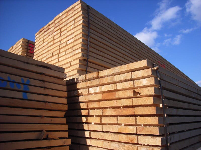 Sawn timber stacked in a port. Sawn timber stacked in a port