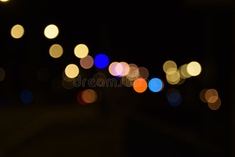 Bokeh city street lights dotted background. Bokeh city street lights in the night background