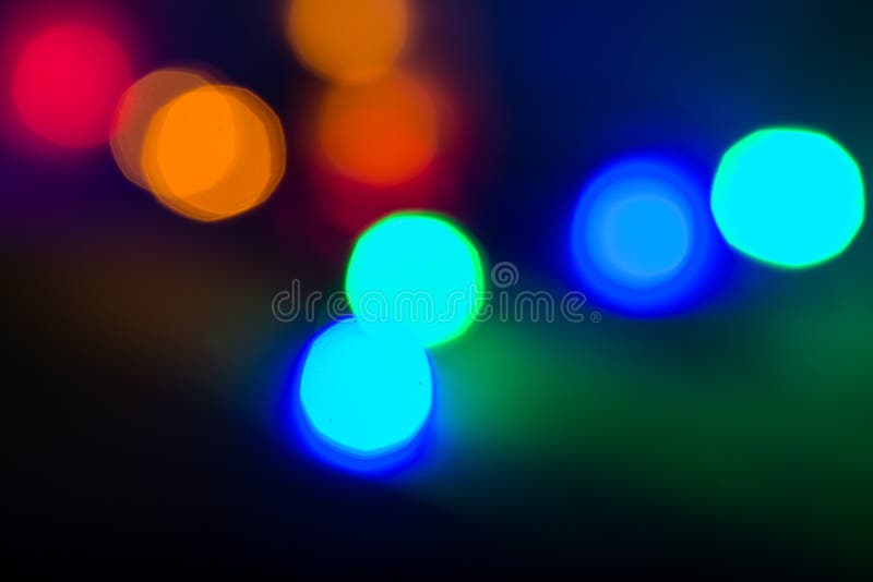 Bokeh coloreado circular sobre fondo oscuro foto de archivo Bokeh coloreado circular sobre fondo oscuro foto de archivo