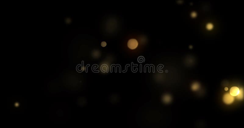 Bokeh light gold shine flares and particles glitter background. Abstract golden bokeh light flares, glowing shiny bright light