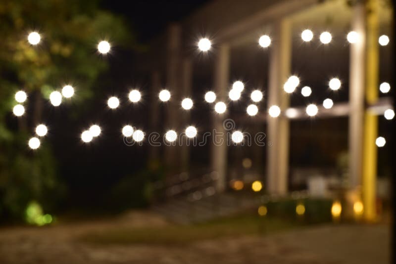 Bokeh lighting decoration at the outdoor restaurant at night.