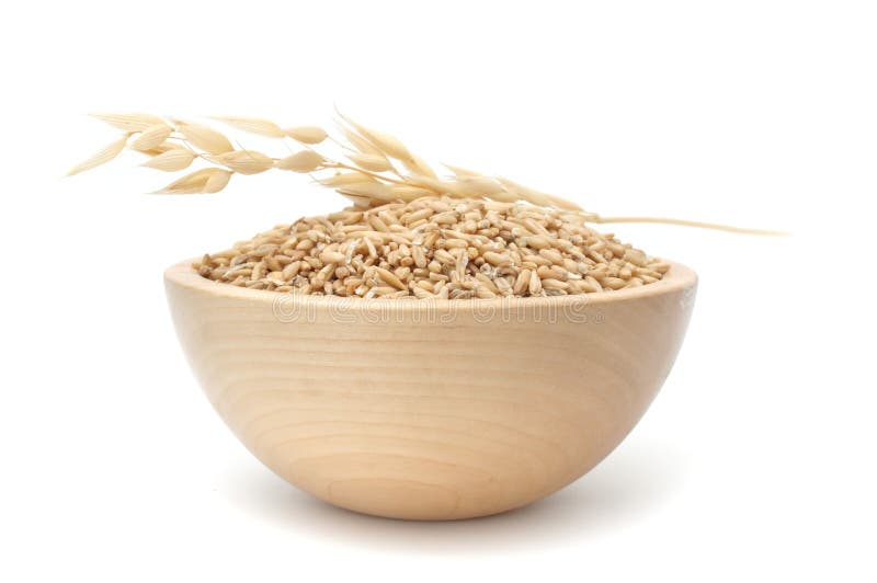 A bowl of whole oats isolated on a white background. A bowl of whole oats isolated on a white background