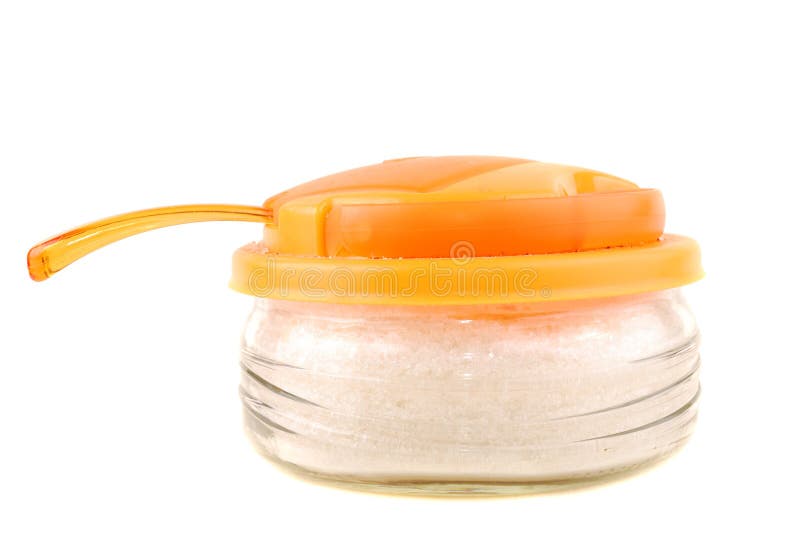 Transparent plastic sugar bowl with an orange cover on a white background. Transparent plastic sugar bowl with an orange cover on a white background