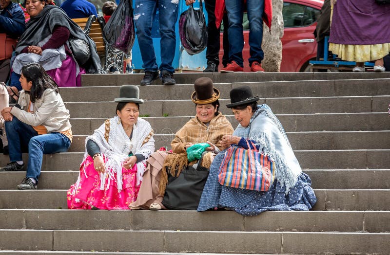 Bolivian Women Sitting On The Steps At Plaza Murillo In La Paz